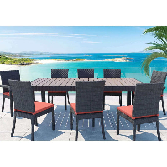Luxurious outdoor dining set with a view of the ocean, featuring a large table and eight stylish chairs.