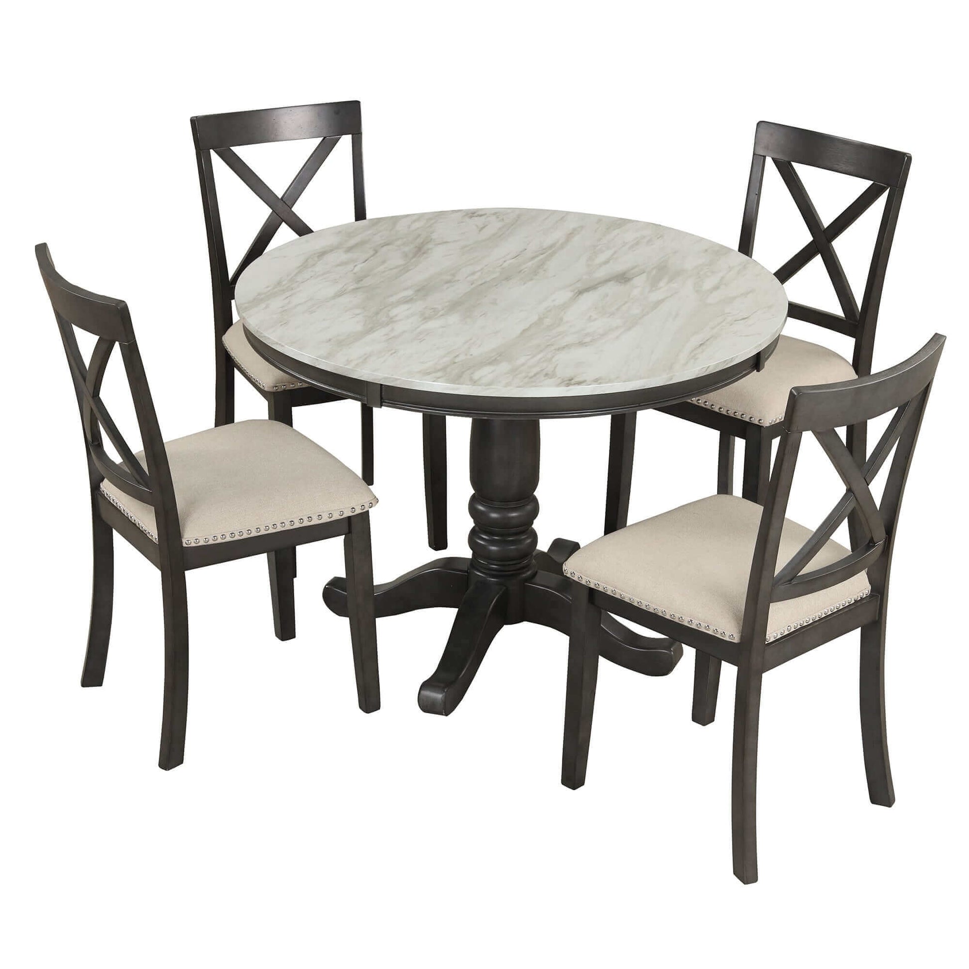 Round marble-top dining table set with four cushioned chairs featuring cross-back design.