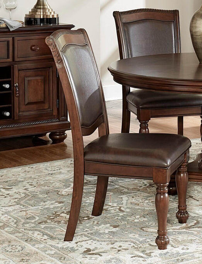 Traditional brown cherry dining chair with wooden legs and upholstered seat next to a round dining table in an elegant dining room.
