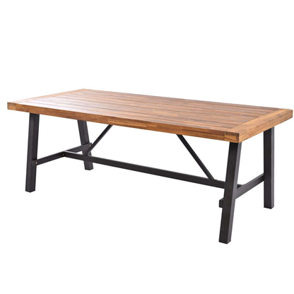 Outdoor wood dining table with thicker tabletop and sturdy black metal legs, perfect for garden patio seating, made of acacia wood.