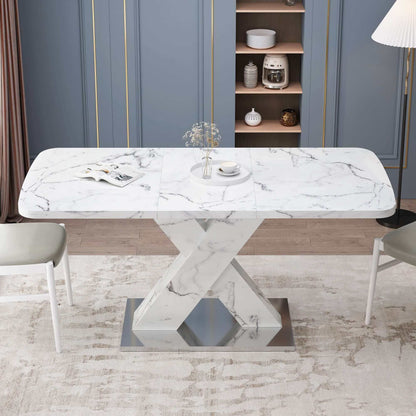 Modern square marble dining table with X-shaped base in stylish dining room setting.