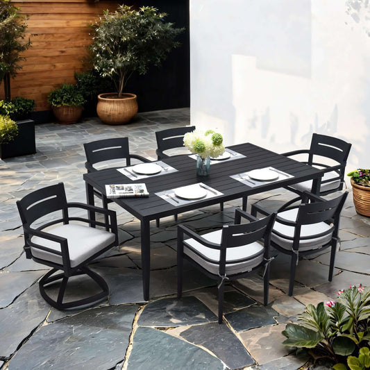 7-piece modern outdoor black aluminum patio furniture set with dining chairs, swivel rockers, and cushioned seats around a rectangular table.