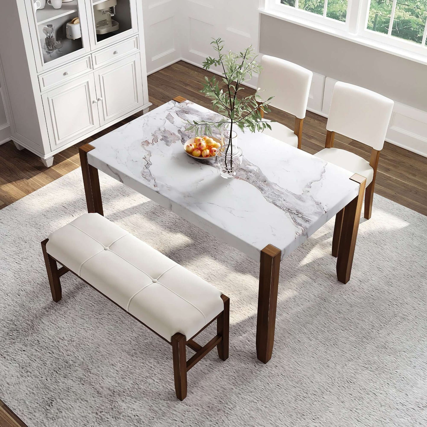 4-piece modern dining furniture set with faux marble table, two upholstered chairs, and a bench in a bright kitchen setting.