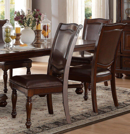 Brown cherry finish dining set with table and four upholstered chairs in a traditional style dining room.