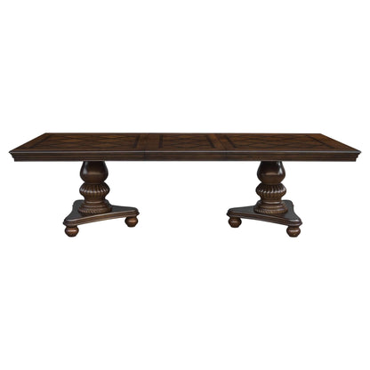 Traditional style brown cherry wood dining table with decorative pedestal legs, perfect for enhancing dining room warmth and style.