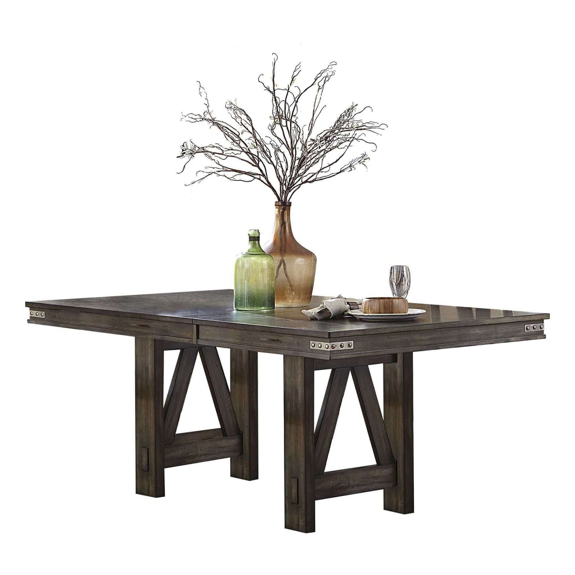 Rustic industrial style dining table with self-storing butterfly leaf, featuring sturdy construction and a centerpiece vase.