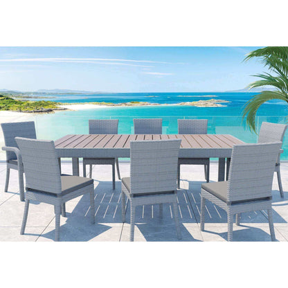 Balcones 9-Piece Outdoor Dining Table Set with 8 Chairs in gray beside a scenic ocean view.