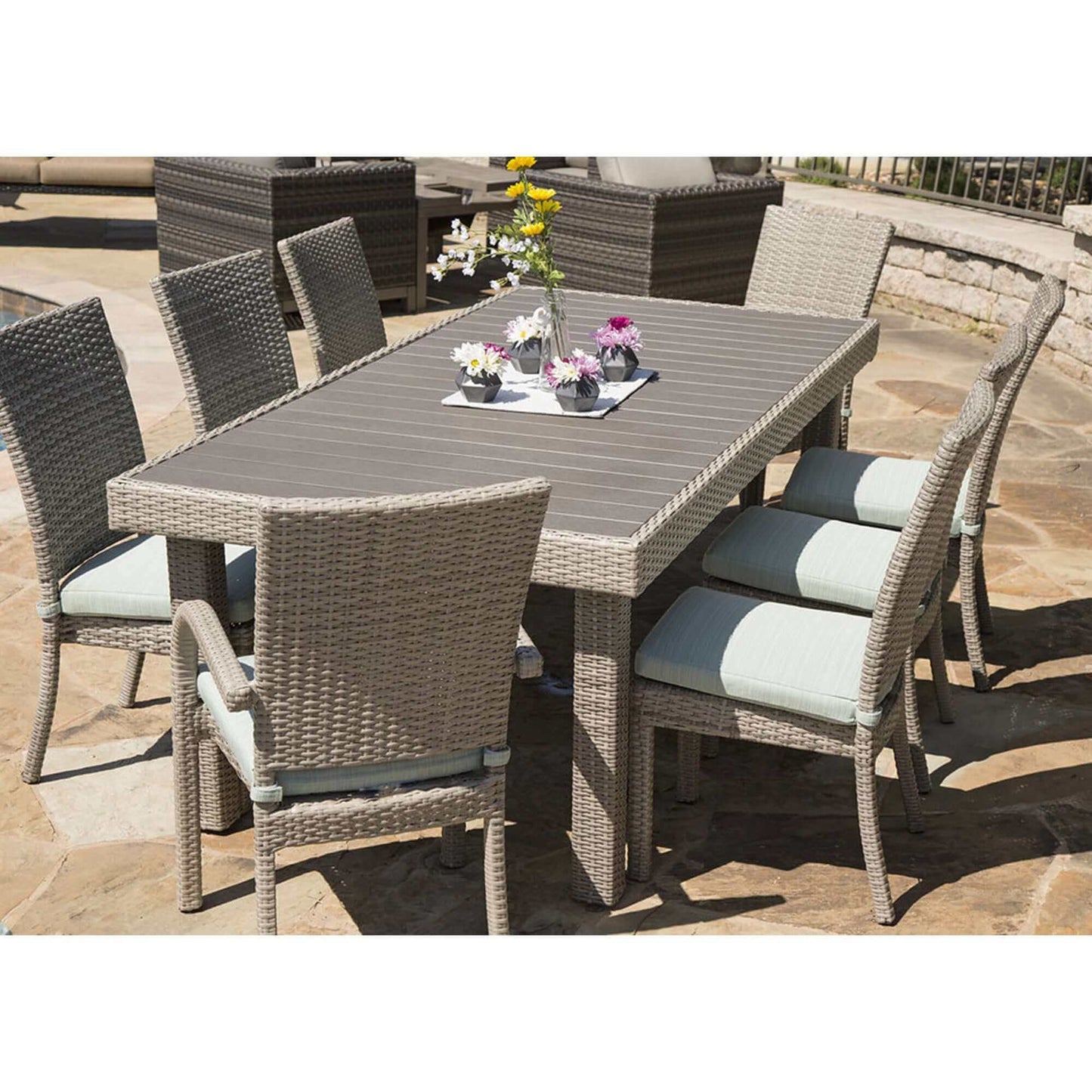 Balcones 9-Piece Outdoor Dining Table Set with gray wicker and aqua cushions, featuring 8 chairs for garden or patio use.