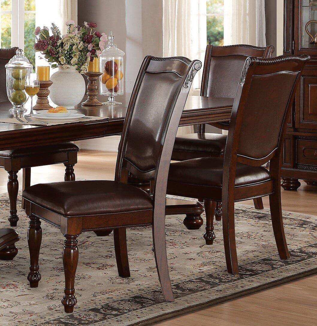 Traditional brown cherry dining table set with 4 upholstered side chairs in a warm dining room setting